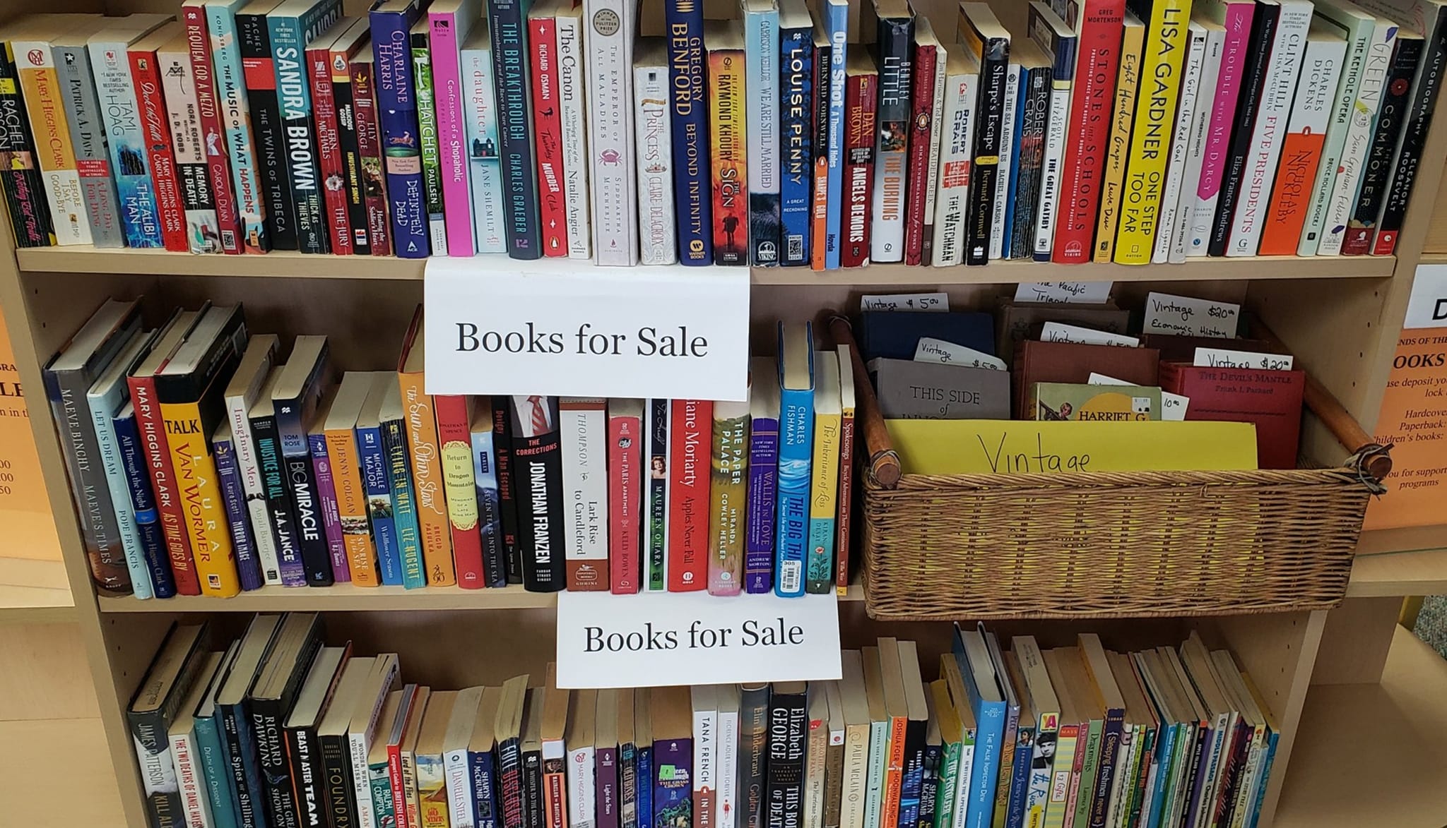 Picture of shelves full of books for sale at the library.